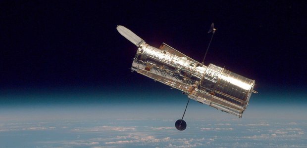 Hubble Space Telescope above Earth.